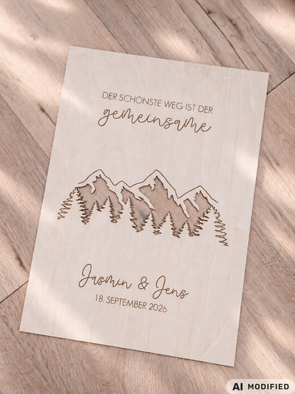 Personalisiertes Geldgeschenk zur Hochzeit aus Holz mit filigran ausgeschnittener Berg- und Waldlandschaft. Hinter den Bergen lassen sich Geldscheine dekorativ platzieren. Mit Gravur „Der schönste Weg ist der gemeinsame“, Namen des Brautpaares und Hochzeitsdatum. Originelles Hochzeitsgeschenk für Braut und Bräutigam, ideal als Geldgeschenk zur Hochzeit, personalisierte Hochzeitsdeko und besondere Geschenkidee für Paare, Bergliebhaber, Wanderfreunde und Naturliebhaber.